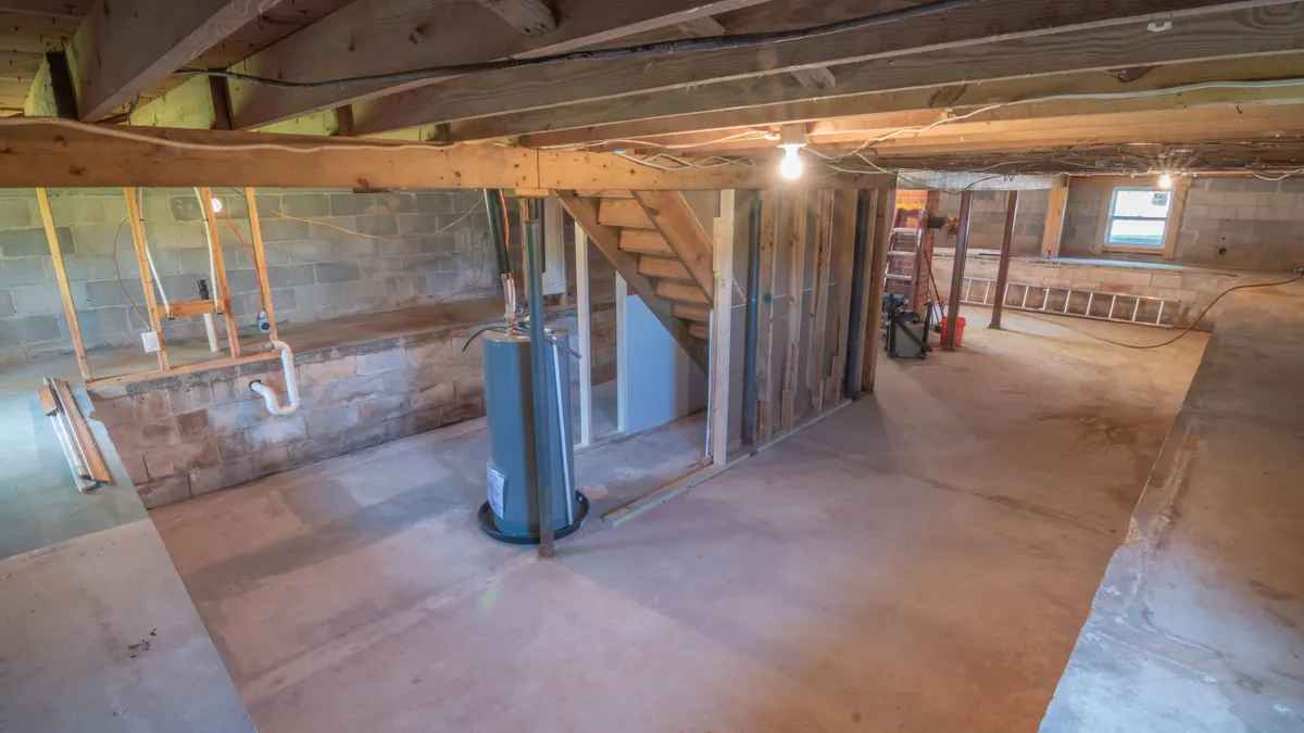Crawlspace showing support posts and beams under a house