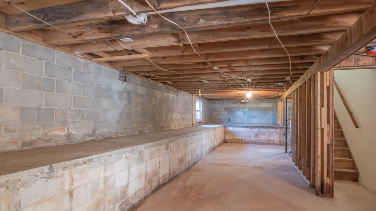 Under-house crawlspace with block walls and joists