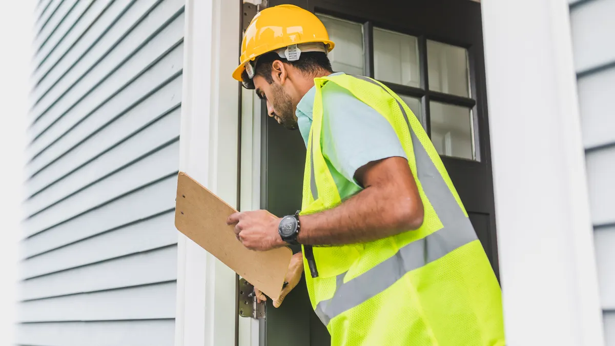 How to Tell If a Pier and Beam House Is Tilting Home inspector inspecting an exterior door